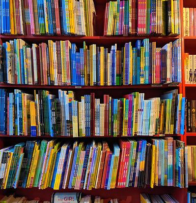Colourful book shelves filled with children's books